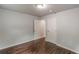 Spacious bedroom featuring dark hardwood floors, neutral walls, and ample closet space at 947 Rebel Forest Dr, Atlanta, GA 30315
