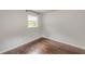 Sunlit room with hardwood floors, light walls, and a bright window view at 947 Rebel Forest Dr, Atlanta, GA 30315