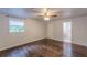 Bedroom with bright window, ceiling fan, and view into ensuite bath at 947 Rebel Forest Dr, Atlanta, GA 30315