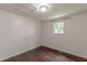 A bedroom featuring wood-look floors, neutral paint and one window at 947 Rebel Forest Dr, Atlanta, GA 30315