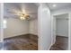Inviting bedroom showcases hardwood floors, fan, and a view to an adjacent space at 947 Rebel Forest Dr, Atlanta, GA 30315