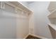 Walk-in closet with ample hanging space and wood-look flooring at 947 Rebel Forest Dr, Atlanta, GA 30315