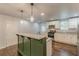 Updated kitchen with white cabinets, granite countertops, and stainless steel appliances at 947 Rebel Forest Dr, Atlanta, GA 30315