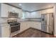 Updated kitchen with stainless steel appliances and plenty of cabinet space at 947 Rebel Forest Dr, Atlanta, GA 30315