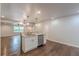 Bright, modern kitchen with island, stainless steel appliances, and hardwood floors at 947 Rebel Forest Dr, Atlanta, GA 30315