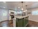 Modern kitchen featuring stainless steel appliances, white cabinets, and a central island at 947 Rebel Forest Dr, Atlanta, GA 30315