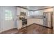 Bright kitchen with white cabinets, stainless steel appliances, and hardwood floors at 947 Rebel Forest Dr, Atlanta, GA 30315