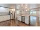 Spacious open-concept kitchen boasts stainless steel appliances and hardwood floors at 947 Rebel Forest Dr, Atlanta, GA 30315