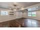 Bright living room with hardwood floors, modern lighting, and large windows at 947 Rebel Forest Dr, Atlanta, GA 30315