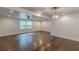 Spacious living room features hardwood floors, recessed lighting, and a ceiling fan at 947 Rebel Forest Dr, Atlanta, GA 30315