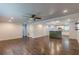 Open-concept living area featuring hardwood floors, recessed lighting, and a partial view into the adjacent kitchen area at 947 Rebel Forest Dr, Atlanta, GA 30315