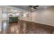 Spacious living area features hardwood flooring and a clear view into the open-concept kitchen with modern appliances at 947 Rebel Forest Dr, Atlanta, GA 30315