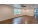 Spacious living room features hardwood flooring, recessed lighting, and a view of the front yard through a large window at 947 Rebel Forest Dr, Atlanta, GA 30315