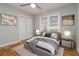 Bright bedroom with a ceiling fan, wooden floors, a neutral color scheme, and modern decor at 1796 Arkose Se Dr, Atlanta, GA 30316