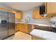 Modern kitchen featuring stainless steel appliances, light wood cabinets, and white countertops at 1796 Arkose Se Dr, Atlanta, GA 30316