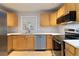 Modern kitchen with stainless steel appliances, light wood cabinets, and bright white countertops at 1796 Arkose Se Dr, Atlanta, GA 30316