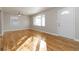 Spacious living room with gleaming hardwood floors, neutral wall color, and plenty of natural light at 1796 Arkose Se Dr, Atlanta, GA 30316