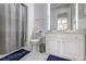 Well-lit bathroom showing a shower behind a curtain, a toilet, and a vanity at 4206 Whitby Se Way # 15, Smyrna, GA 30080