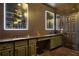 This modern bathroom features dual vanities with ample counter space, stylish lighting, and unique green cabinetry at 4206 Whitby Se Way # 15, Smyrna, GA 30080