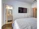 Bedroom with hardwood floors, bathroom, and TV at 4206 Whitby Se Way # 15, Smyrna, GA 30080
