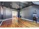 Bonus room features wood floors, ceiling fan, and open floor plan at 4206 Whitby Se Way # 15, Smyrna, GA 30080