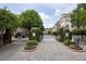 Elegant gated entrance with brick pillars and lush landscaping, creating a welcoming and secure entry to the neighborhood at 4206 Whitby Se Way # 15, Smyrna, GA 30080