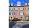 Elegant brick townhome showcasing classic architectural details, black shutters, and professionally landscaped grounds at 4206 Whitby Se Way # 15, Smyrna, GA 30080