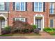 Charming brick townhome with a well-manicured front yard and a striking Japanese maple tree at 4206 Whitby Se Way # 15, Smyrna, GA 30080