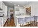 Modern kitchen featuring white cabinets, a large island with seating, and stainless steel appliances at 4206 Whitby Se Way # 15, Smyrna, GA 30080