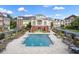 Gorgeous community pool surrounded by lounge chairs and tables, perfect for relaxation and socializing at 4206 Whitby Se Way # 15, Smyrna, GA 30080