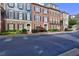 Exterior shot of townhomes along a street, highlighting architectural details at 4206 Whitby Se Way # 15, Smyrna, GA 30080