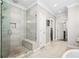 Modern bathroom showcasing a glass-enclosed shower with a built-in bench at 4538 Collins Ave, Sandy Springs, GA 30342
