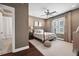 Cozy bedroom with a metal bed frame, neutral tones, and an ensuite bathroom at 4538 Collins Ave, Sandy Springs, GA 30342