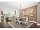 Spacious dining room with hardwood floors, chandelier, and views to the kitchen at 4538 Collins Ave, Sandy Springs, GA 30342