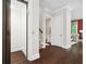 Bright hallway features an elevator, hardwood floors, and access to other rooms at 4538 Collins Ave, Sandy Springs, GA 30342