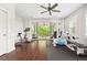 Bright home gym features dark wood floors and patio doors leading to an outdoor seating area at 4538 Collins Ave, Sandy Springs, GA 30342