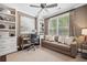Comfortable home office with built-in shelves, a large window, and stylish decor at 4538 Collins Ave, Sandy Springs, GA 30342