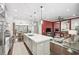 Open kitchen features center island, stainless appliances, and flows into the living area at 4538 Collins Ave, Sandy Springs, GA 30342