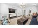 Stylish living room with decorative wall trim, a flat screen tv, and modern decor at 4538 Collins Ave, Sandy Springs, GA 30342