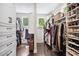 Organized walk-in closet offers ample storage and natural light at 4538 Collins Ave, Sandy Springs, GA 30342