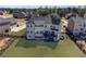 Aerial view of expansive backyard with a wooden fence, deck, and patio. Great for outdoor activities at 6355 Westfallen Overlook, Cumming, GA 30040