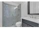 Modern bathroom features a glass-enclosed shower with stylish tile work and updated fixtures at 6355 Westfallen Overlook, Cumming, GA 30040