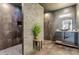 Modern bathroom with stone accents, a vessel sink, and sleek design offering a luxurious spa-like atmosphere at 6355 Westfallen Overlook, Cumming, GA 30040