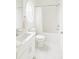 Clean and bright bathroom featuring white fixtures, a shower-tub combo, and an oval window at 6355 Westfallen Overlook, Cumming, GA 30040