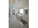 Spacious bathroom with double vanities, soaking tub, walk-in shower, and tiled floor at 6355 Westfallen Overlook, Cumming, GA 30040