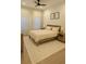 Cozy bedroom with a ceiling fan, natural light, and neutral tones creating a relaxing atmosphere at 6355 Westfallen Overlook, Cumming, GA 30040