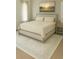 Bedroom features a bed with floral patterned bedding, bedside tables, and neutral decor at 6355 Westfallen Overlook, Cumming, GA 30040