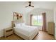 Inviting bedroom with hardwood floors, a large window, and contemporary decor at 6355 Westfallen Overlook, Cumming, GA 30040