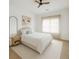 Bright bedroom with a minimalist design, featuring a neutral palette and sheer curtains at 6355 Westfallen Overlook, Cumming, GA 30040