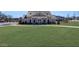Beautifully landscaped community clubhouse with well-maintained lawn and surrounding neighborhood views at 6355 Westfallen Overlook, Cumming, GA 30040